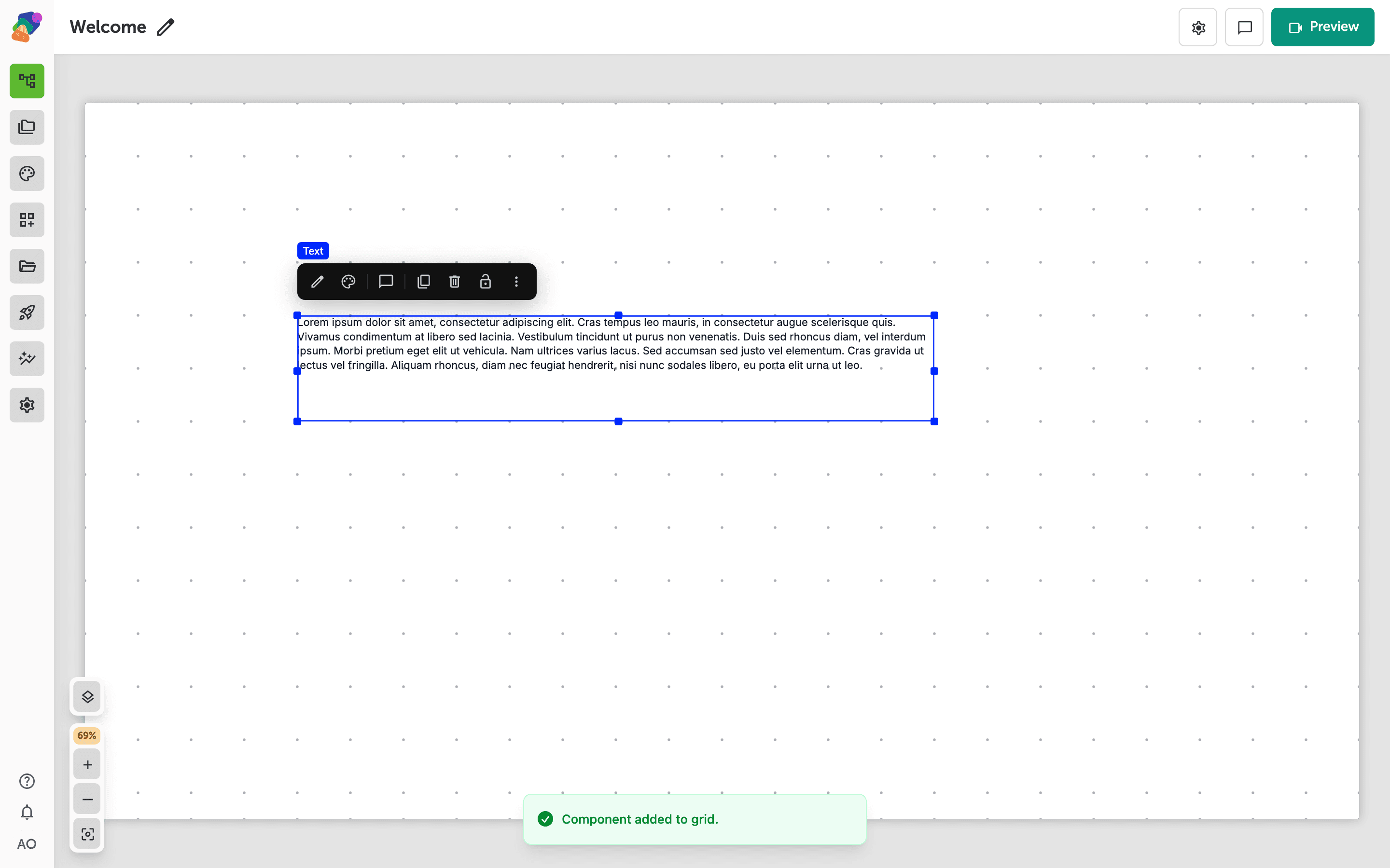 A text component selected on the dotted-grid canvas with a blue bounding box and resize handles, a floating action toolbar above it, and a green confirmation banner reading 'Component added to grid' at the bottom of the screen