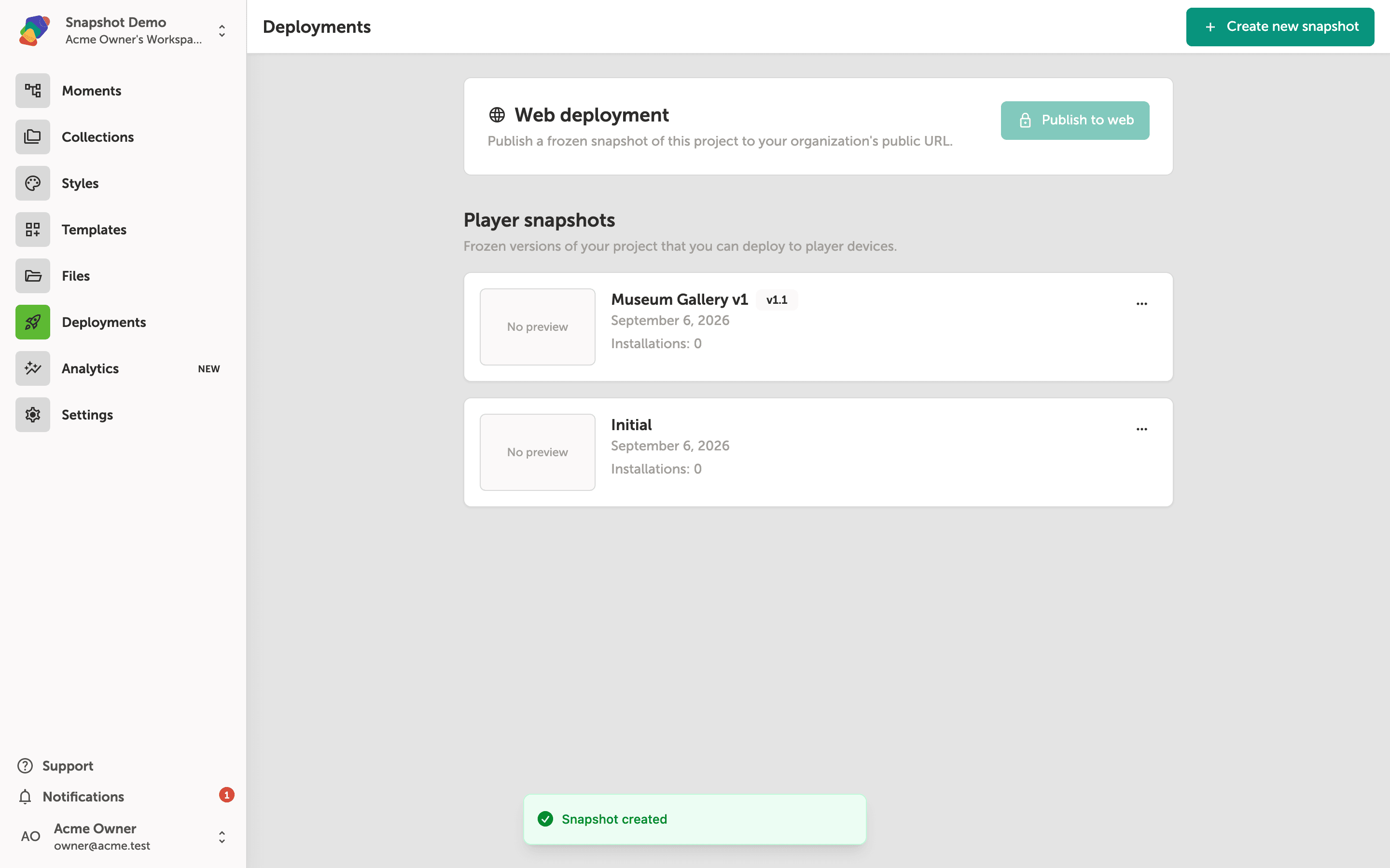 The Deployments page showing two player snapshot cards—Museum Gallery v1 and Initial—with a green 'Snapshot created' confirmation banner at the bottom of the screen