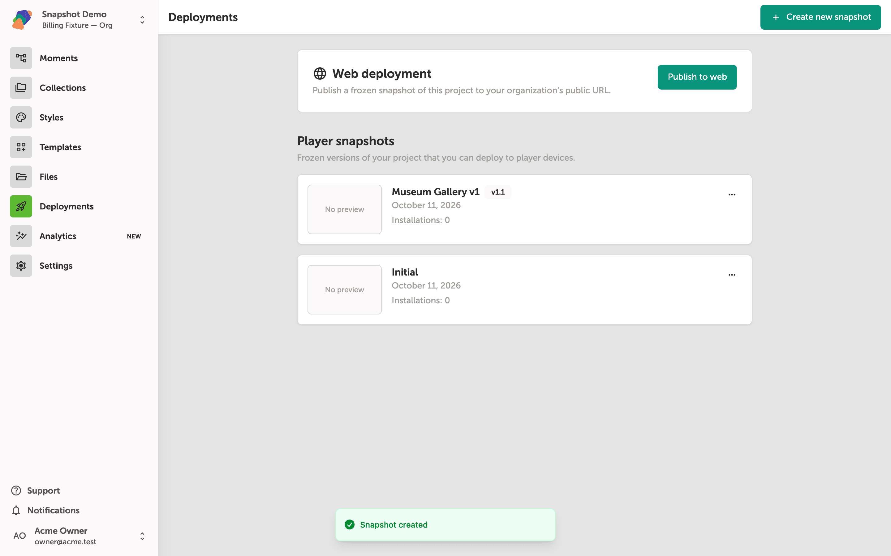 The Deployments page showing two player snapshot cards—Museum Gallery v1 and Initial—with a green 'Snapshot created' confirmation banner at the bottom of the screen