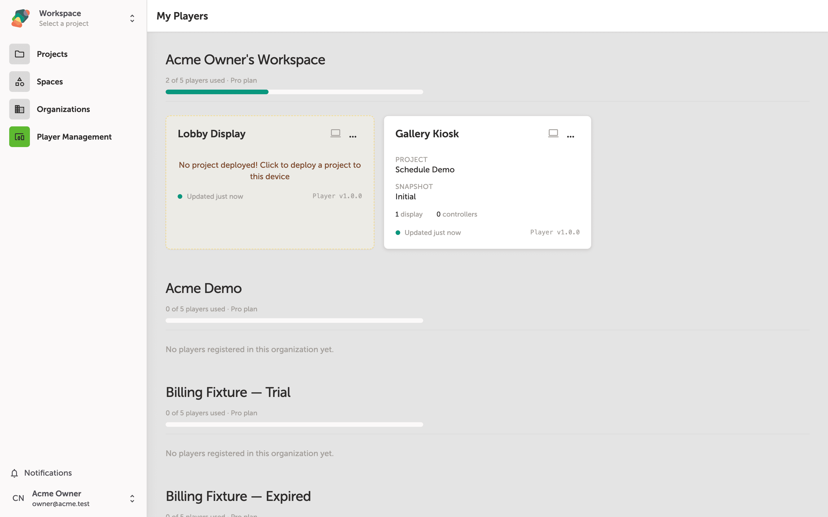 The My Players page showing device cards grouped by organization name, with download options for the Zibit Player app listed at the top right