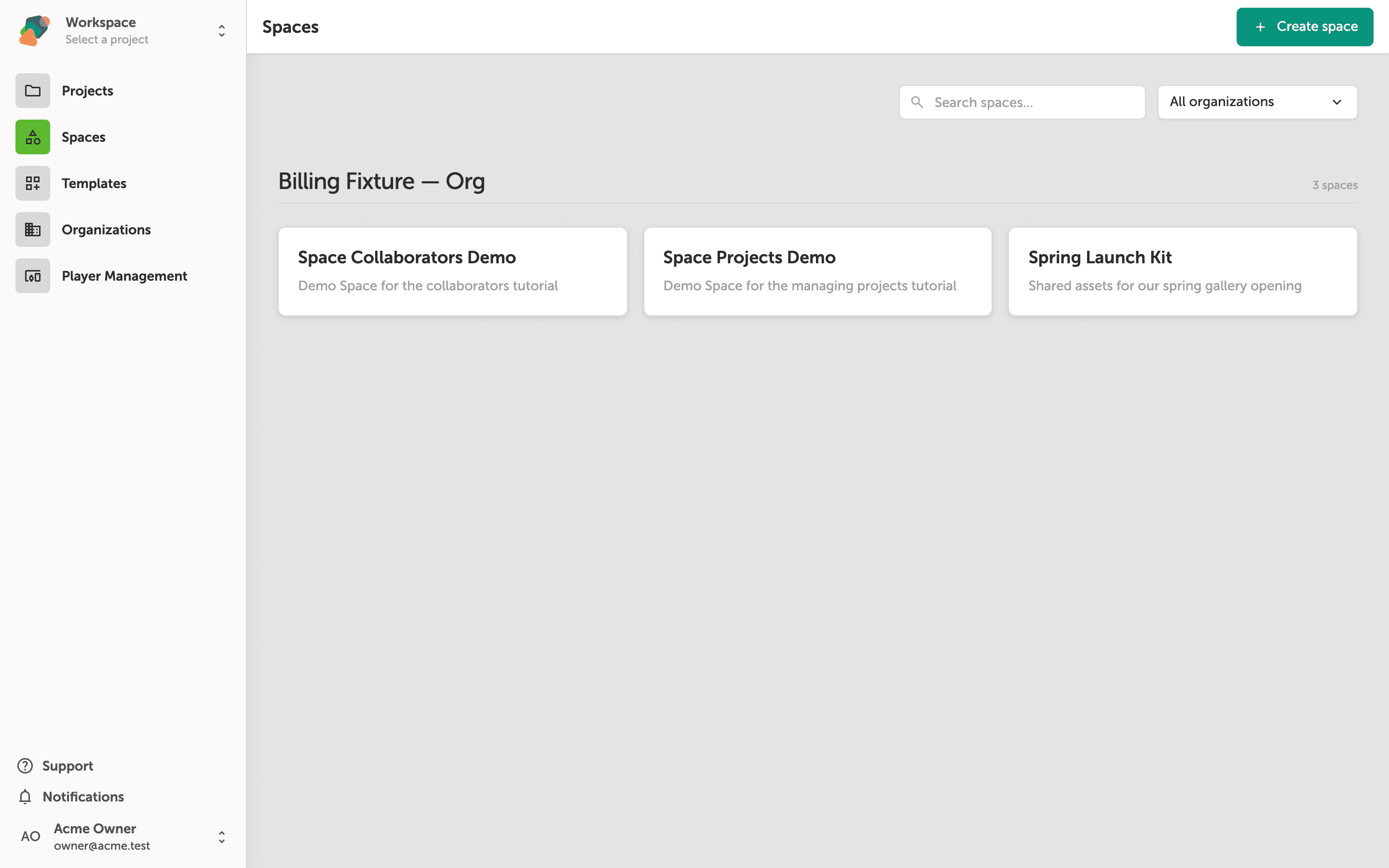 The Zibit Spaces page showing three Space cards: Space Collaborators Demo, Space Projects Demo, and Spring Launch Kit, under the heading Acme Owner's Workspace